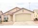 Attractive single story home featuring a two car garage, tile roof and desert landscaping at 5112 Foggia Ave, Las Vegas, NV 89130