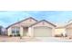 Single story home with desert landscaping, attached two car garage, and tile roof at 5112 Foggia Ave, Las Vegas, NV 89130