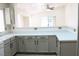 Kitchen with white cabinets, light countertops, and view into the living area at 5112 Foggia Ave, Las Vegas, NV 89130