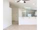 Open-concept living room showcasing tile floors, skylights, and breakfast bar leading into the kitchen at 5112 Foggia Ave, Las Vegas, NV 89130