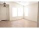 Bright, airy living room with neutral walls, tile flooring, and a front door at 5112 Foggia Ave, Las Vegas, NV 89130