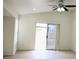 Bright, airy living room with sliding glass door leading to outdoor patio at 5112 Foggia Ave, Las Vegas, NV 89130