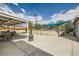 Spacious backyard with pool, patio, dining area, mature trees, and open space for outdoor activities at 5217 Champions Ave, Las Vegas, NV 89142