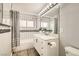 Updated bathroom with subway tile, shower-tub combo, and white vanity at 5217 Champions Ave, Las Vegas, NV 89142