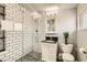 Newly remodeled bathroom features subway tile, a glass enclosed shower, and modern fixtures at 5217 Champions Ave, Las Vegas, NV 89142