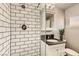 Updated bathroom features subway tile, a glass enclosed shower, and sleek modern fixtures at 5217 Champions Ave, Las Vegas, NV 89142