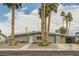 Beautiful single-story home featuring desert landscaping, charming walkway, and an attached carport at 5217 Champions Ave, Las Vegas, NV 89142