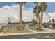 Charming single-story home with desert landscaping, palm trees, and a welcoming front entrance at 5217 Champions Ave, Las Vegas, NV 89142