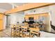 Open-concept kitchen area with a breakfast bar and modern appliances at 5217 Champions Ave, Las Vegas, NV 89142