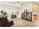 Spacious living room features wood laminate flooring, a vaulted ceiling, and bright white walls at 5217 Champions Ave, Las Vegas, NV 89142