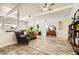 Spacious living room features an accent wall, wood flooring, and bright natural lighting at 5217 Champions Ave, Las Vegas, NV 89142