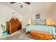 Relaxing main bedroom featuring carpet flooring, ample lighting, and charming decor at 5217 Champions Ave, Las Vegas, NV 89142