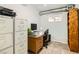A well-lit office area with filing cabinets, desk, and storage at 5217 Champions Ave, Las Vegas, NV 89142