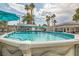 Backyard pool featuring cool, clear water, palm trees, and an umbrella providing shade at 5217 Champions Ave, Las Vegas, NV 89142