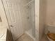 Updated bathroom with a walk-in shower featuring marble-like tile surround and a glass shower door at 5424 Comchec Way # 101, Las Vegas, NV 89108