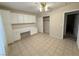 Bright bedroom with tile floors, ample built-in storage, a large closet, and neutral walls at 5424 Comchec Way # 101, Las Vegas, NV 89108