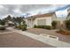 Charming single-story home features a well-maintained front yard with mature landscaping at 5424 Comchec Way # 101, Las Vegas, NV 89108