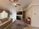 Cozy living room with a ceiling fan, neutral paint, carpet, and lots of natural light at 5424 Comchec Way # 101, Las Vegas, NV 89108