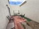 Enclosed patio with a swing, table, and chairs, perfect for enjoying the outdoors at 5424 Comchec Way # 101, Las Vegas, NV 89108