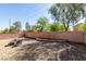 Large backyard with neutral stone and room to create your perfect backyard at 6052 Puesta Del Sol St, North Las Vegas, NV 89081