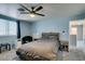 Inviting bedroom featuring a neutral color scheme and a large window at 6052 Puesta Del Sol St, North Las Vegas, NV 89081