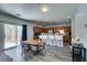 Dining area offering access to a modern kitchen with a breakfast bar and views of the backyard at 6052 Puesta Del Sol St, North Las Vegas, NV 89081