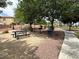 Scenic community park offers a picnic area, a walking path, trees and green space at 6052 Puesta Del Sol St, North Las Vegas, NV 89081
