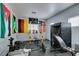 Workout area featuring weights and equipment, decorated with a display of vibrant flags at 6052 Puesta Del Sol St, North Las Vegas, NV 89081