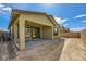 Exterior view of the home's patio, backyard, and block wall at 6607 Summershade St, North Las Vegas, NV 89086