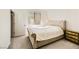 Cozy bedroom with tufted headboard, carpet flooring, and natural light at 6607 Summershade St, North Las Vegas, NV 89086