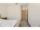 Bright bedroom with carpet flooring, and a connecting bathroom at 6607 Summershade St, North Las Vegas, NV 89086