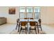 Stylish dining area with modern table and chairs, complemented by natural light and contemporary decor at 6607 Summershade St, North Las Vegas, NV 89086