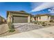 Inviting single-story home with a neutral exterior and a paved driveway at 6607 Summershade St, North Las Vegas, NV 89086