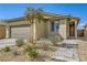 Attractive one-story home featuring a neutral color scheme and xeriscaping at 6607 Summershade St, North Las Vegas, NV 89086