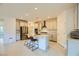 Modern kitchen with stainless steel appliances, a large island, and ample cabinet space, ideal for cooking at 6607 Summershade St, North Las Vegas, NV 89086