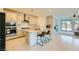 Contemporary kitchen featuring an island with barstools, stainless steel appliances, and modern finishes at 6607 Summershade St, North Las Vegas, NV 89086