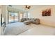 Spacious living room with a plush sofa and a sliding glass door to the patio at 6607 Summershade St, North Las Vegas, NV 89086