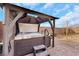 Relax in this backyard hot tub with a private overhead pergola and seating area at 7115 Calvert Cliffs St, North Las Vegas, NV 89084