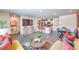 Open floor plan with modern decor featuring living, kitchen, and dining spaces at 7375 Hayes Harbor Ct # Lot 210, North Las Vegas, NV 89084