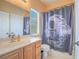 Bathroom featuring a single sink vanity and a shower with a Star Wars themed shower curtain at 8106 Eagle Clan Ct, Las Vegas, NV 89131