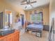 Bedroom with ceiling fan, carpet floors, and a window with natural light at 8106 Eagle Clan Ct, Las Vegas, NV 89131