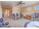 Spacious bonus room with carpet, ceiling fan, and game tables, perfect for recreation and relaxation at 8106 Eagle Clan Ct, Las Vegas, NV 89131
