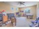 Large bonus room with a ceiling fan and multiple desks, ideal for entertainment, work, and games at 8106 Eagle Clan Ct, Las Vegas, NV 89131
