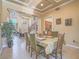 Formal dining room showcasing elegant decor, a large window, and abundant natural light at 8106 Eagle Clan Ct, Las Vegas, NV 89131