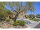 Charming two-story home featuring a well-manicured front yard and an attached two-car garage at 8106 Eagle Clan Ct, Las Vegas, NV 89131