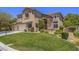 Charming two-story home with a well-manicured lawn, three car garage, and stone accents at 8106 Eagle Clan Ct, Las Vegas, NV 89131