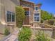 Charming two-story home with a stone-accented entrance and well-manicured landscaping at 8106 Eagle Clan Ct, Las Vegas, NV 89131