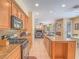 Open kitchen featuring granite countertops, a gas cooktop, and seamless flow to the living room at 8106 Eagle Clan Ct, Las Vegas, NV 89131