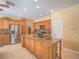 Spacious kitchen featuring granite countertops, stainless steel appliances, and custom wood cabinetry at 8106 Eagle Clan Ct, Las Vegas, NV 89131