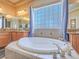Bright main bathroom features a large soaking tub and ample counter space, perfect for relaxation at 8106 Eagle Clan Ct, Las Vegas, NV 89131